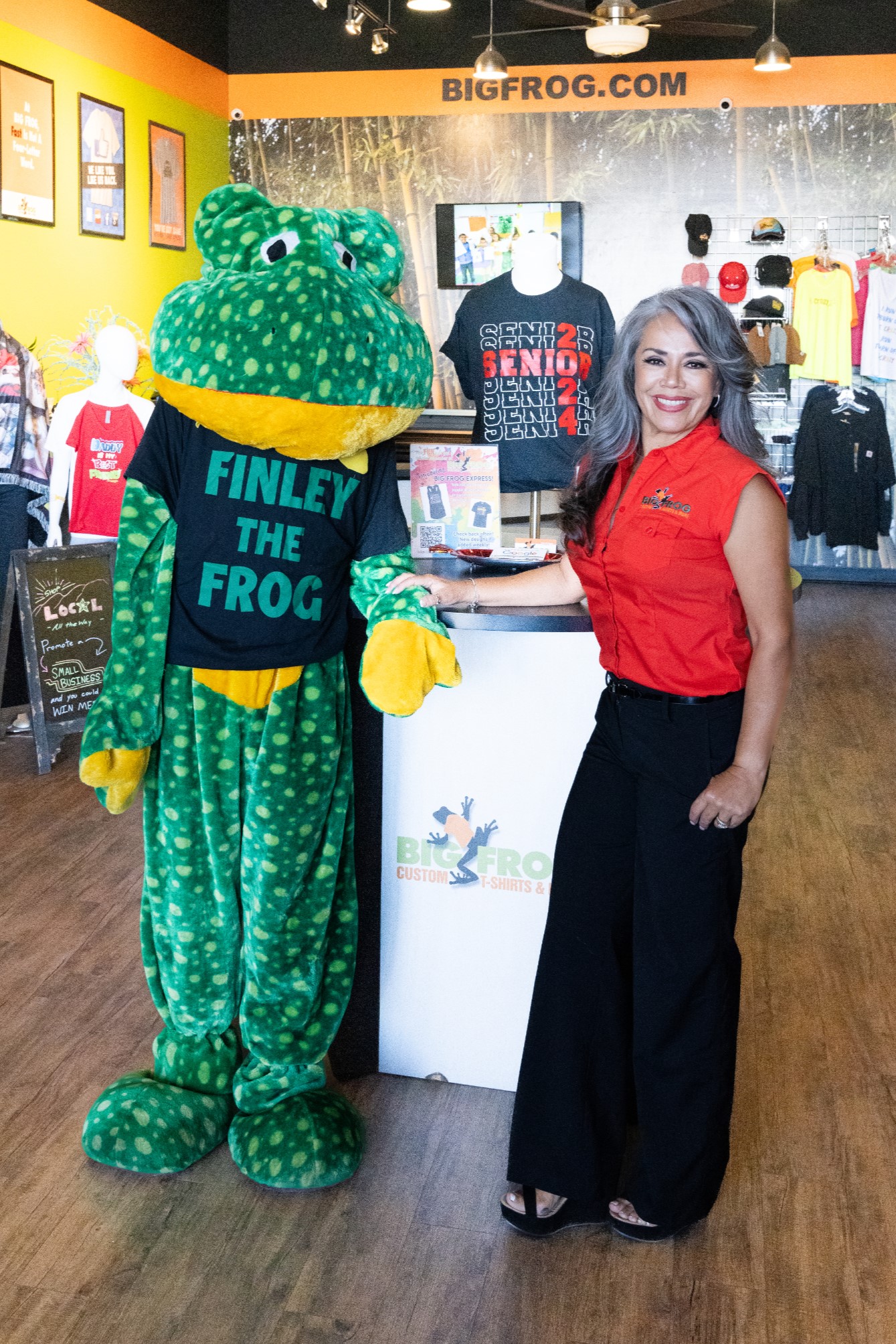 Big Frog of East El Paso Store Owner Angie Rodriguez with Finley the Frog