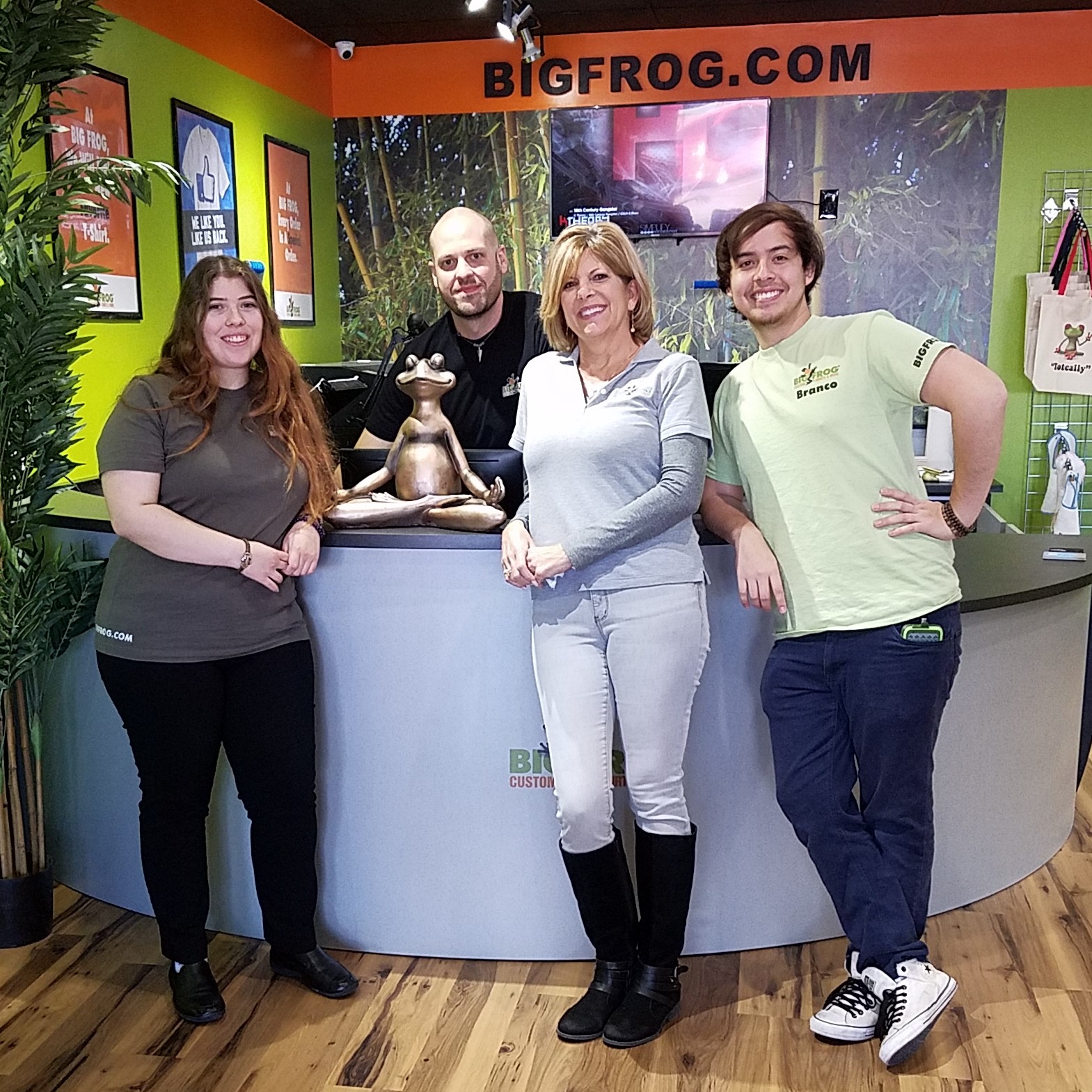 Big Frog of San Antonio North Lisa Pirolo and her Team standing in her Big Frog Store