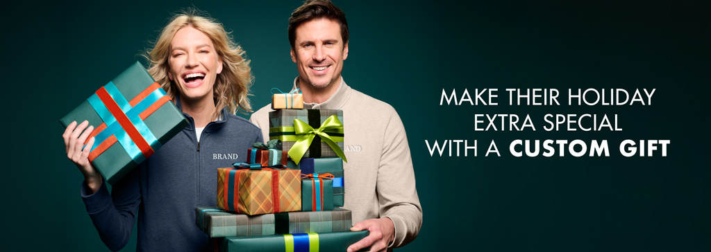 Image of Smiling woman and man hold colorful wrapped holiday gifts against a dark teal backdrop, beside the message: “Make their holiday extra special with a custom gift.”
