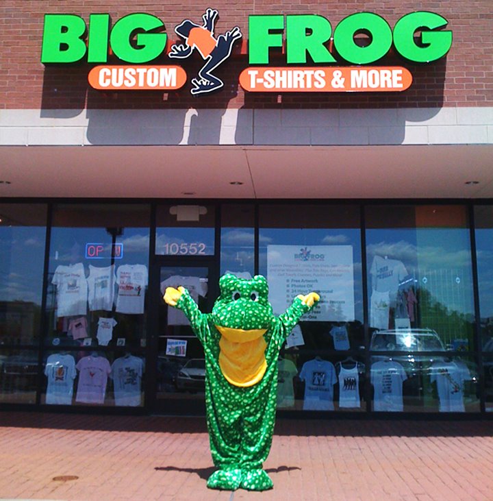 Big Frog Custom T-Shirts & More mascot in front of one of Big Frog's store locations